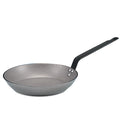 A gray French carbon steel frying pan with long handle.